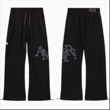 AMIRI Staggered Logo Track Pants | Black