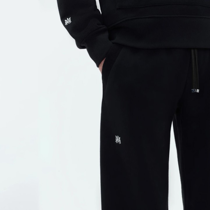 AMIRI Staggered Logo Track Pants | Black